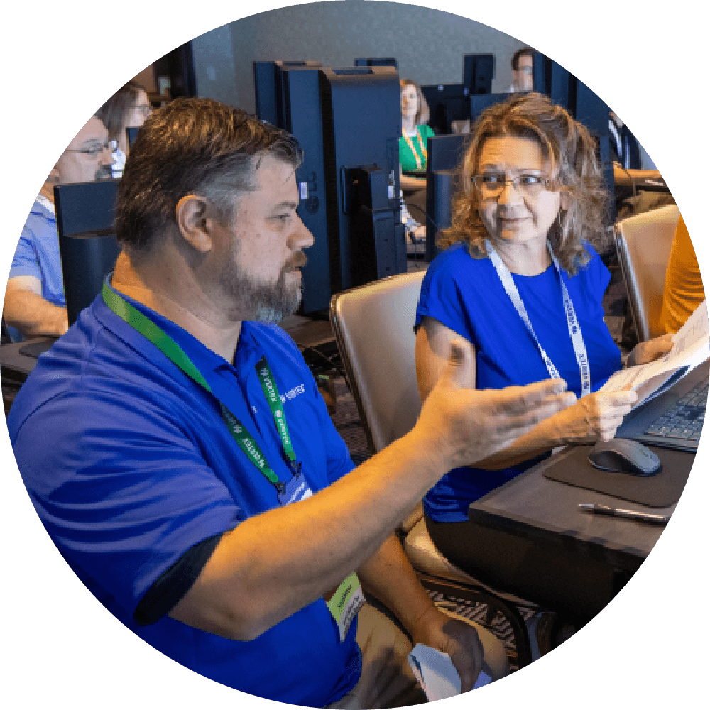 One of Vertex's tax- and platform-experts supports a customer from the side of her workstation.